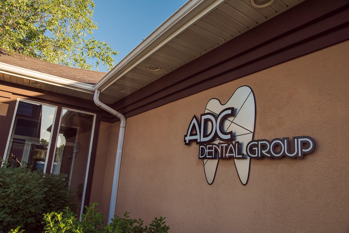 Outside front view of the dental office displaying logo.