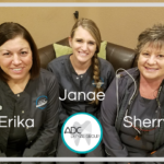 Women dental hygienists sitting at the office and smiling.