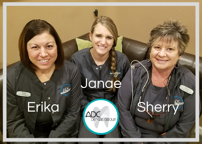 Women dental hygienists sitting at the office and smiling.