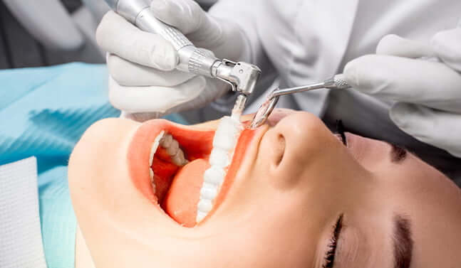 woman having her teeth cleaned