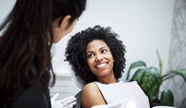 smiling woman sitting in a dental chair