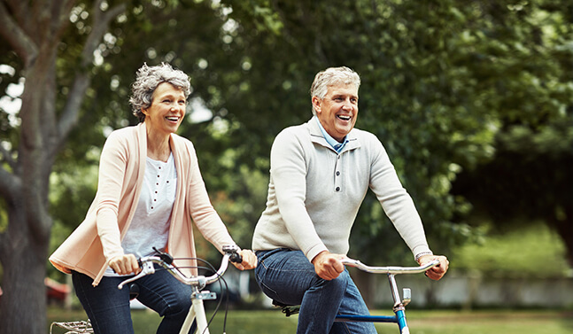 senior couple on bikes