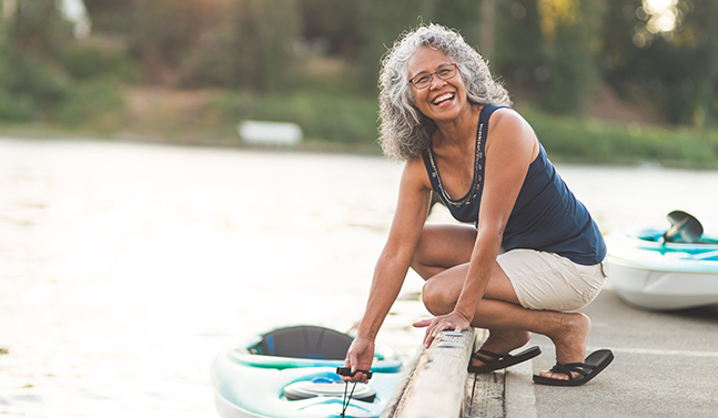 senior woman with a kayak