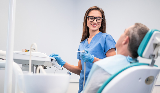 dental assistant working on patient