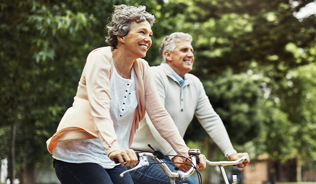 senior couple riding bikes together