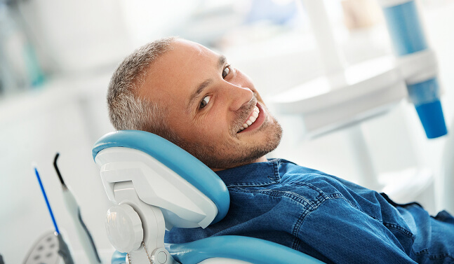 smiling man at the dentist