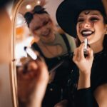 woman smiling in halloween costume considering cosmetic dentistry
